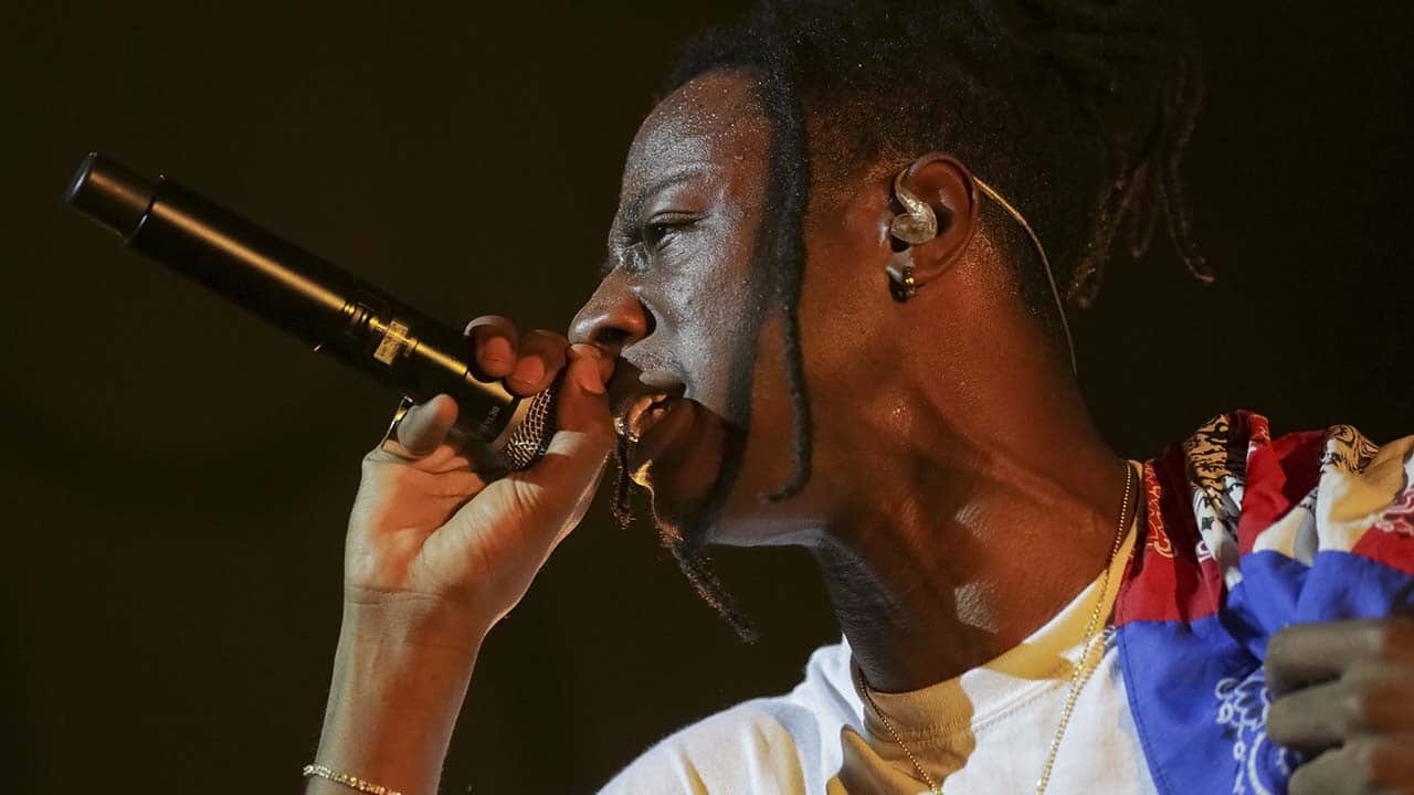 Rapper Joey Bada$$ performs on stage at the Pier Six Concert Pavilion on Thursday, Aug. 10, 2017, in Baltimore