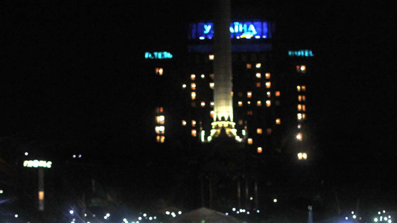 People turn on cell phones and flash lights in Ukraine