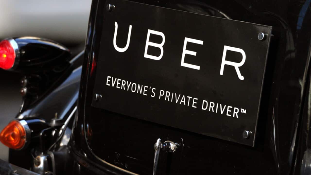 Uber signage on a vintage car