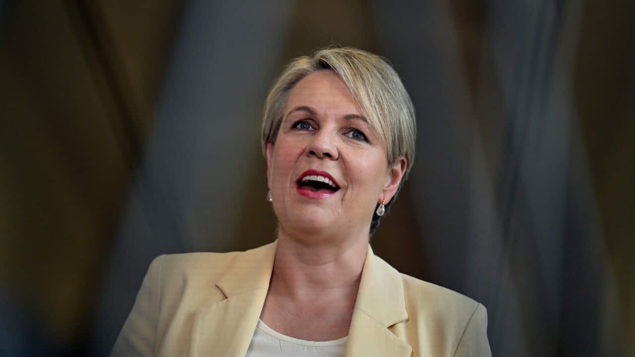A woman smiling