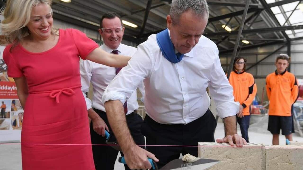 Bill Shorten (L) and his wife Chloe in Perth.
