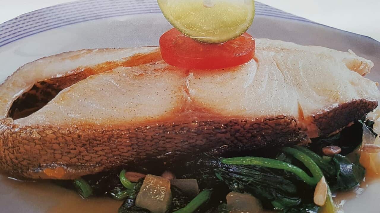 Pan-fried cod with spinach.