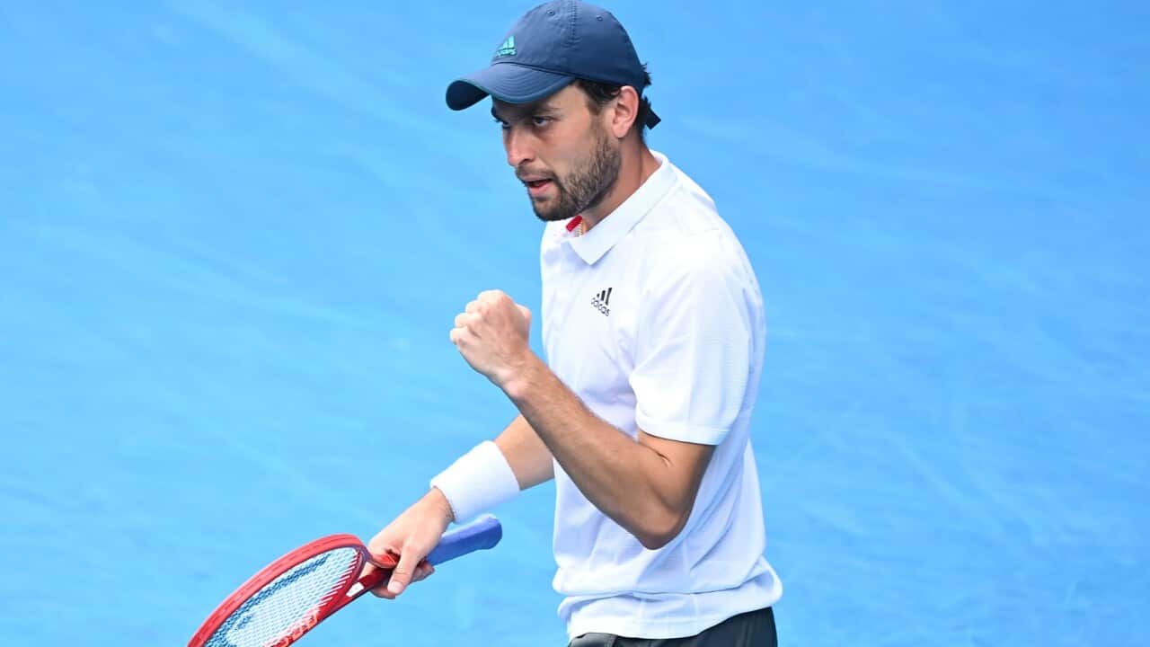 Aslan Karatsev of Russia reacts after defeating Grigor Dimitrov of Bulgaria during the Quarterfinals Men's singles match against on Day 9 of the Australian Open at Melbourne Park in Melbourne, Tuesday, February 16, 2021.