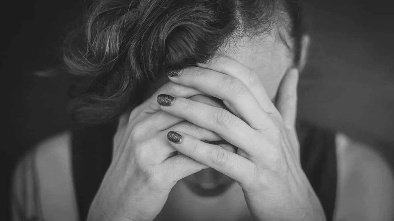 Portrait of depressed woman, sad woman, woman having headache, worried woman