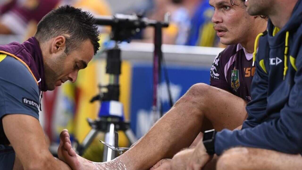 James Roberts of the Broncos has his ankle iced.