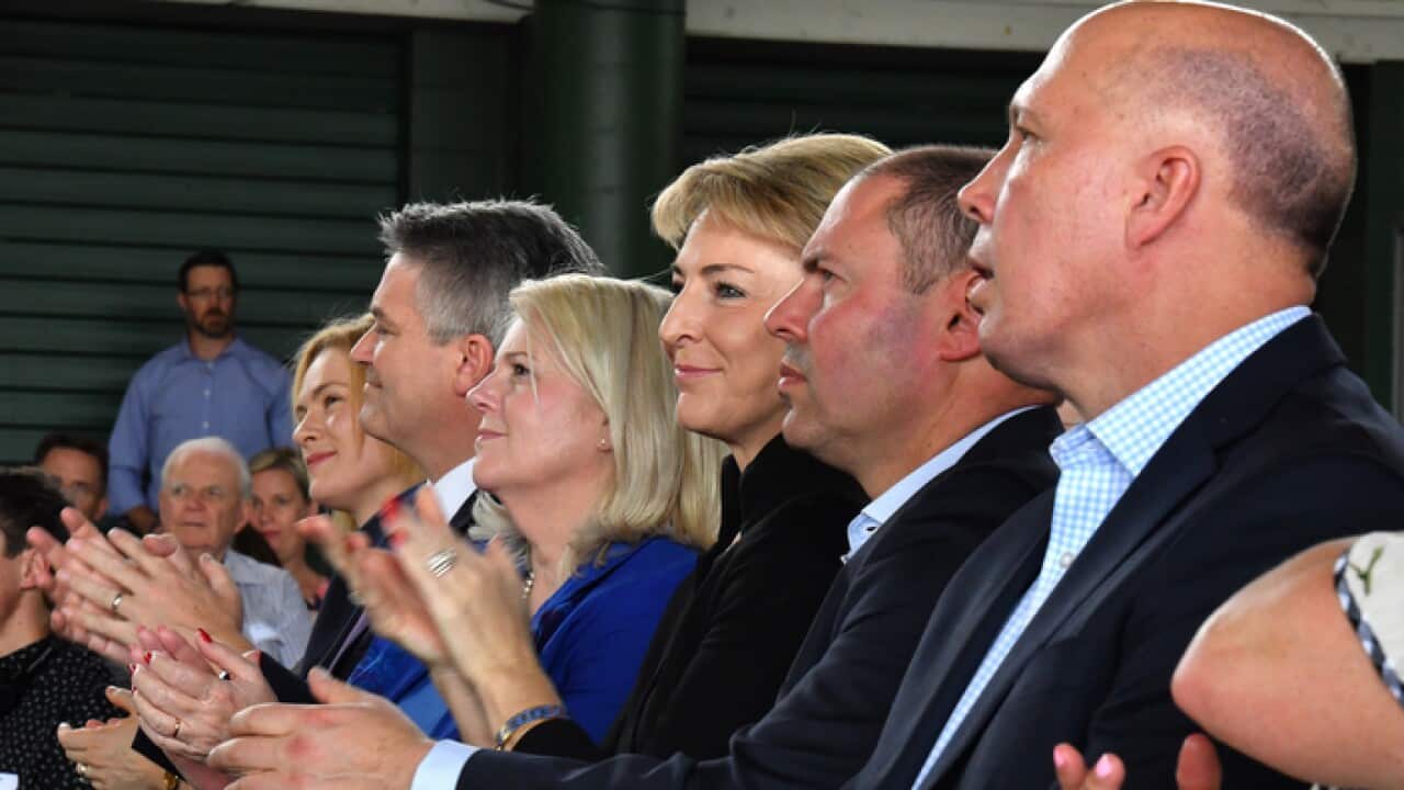 (L-R) Liberal Senator Amanda Stoker, Minister for Finance Mathias Cormann, Minister for Industry Karen Andrews, Minister for Small Business Michaelia Cash, Treasurer Josh Frydenberg and Minister for Home Affairs Peter Dutton applaud Prime Minister Scott M