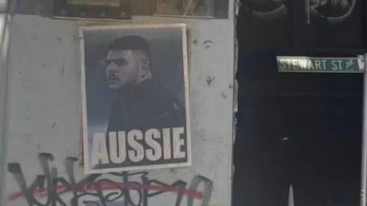 A poster with an image of alleged Bondi gunman Naveed Akram and the word “AUSSIE“ written underneath it.