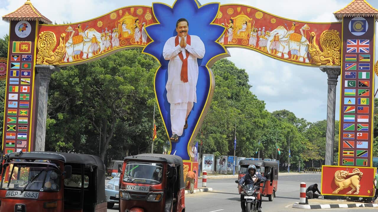 An archway with a portrait of Sri Lankan President Mahinda Rajapakse in the capital, Colombo, ahead of the CHOGM Getty.jpg