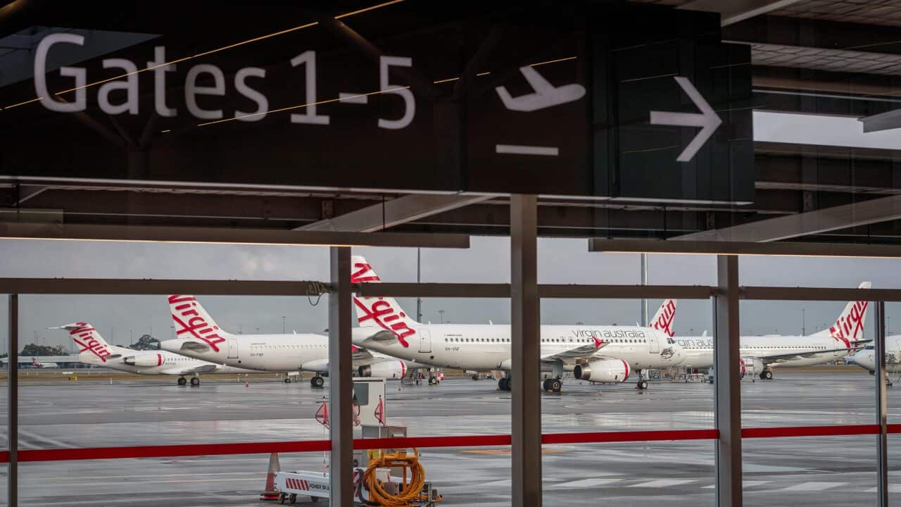 A general view of Virgin Australia aircraft at T2 Perth Domestic Airport terminal in Perth, Saturday, April 25, 2020. (AAP Image/Richard Wainwright) NO ARCHIVING