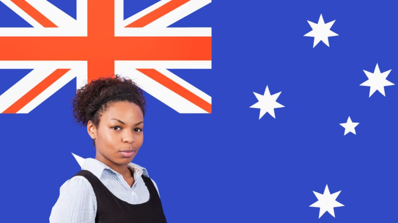Young businesswoman smiling over Australian flag