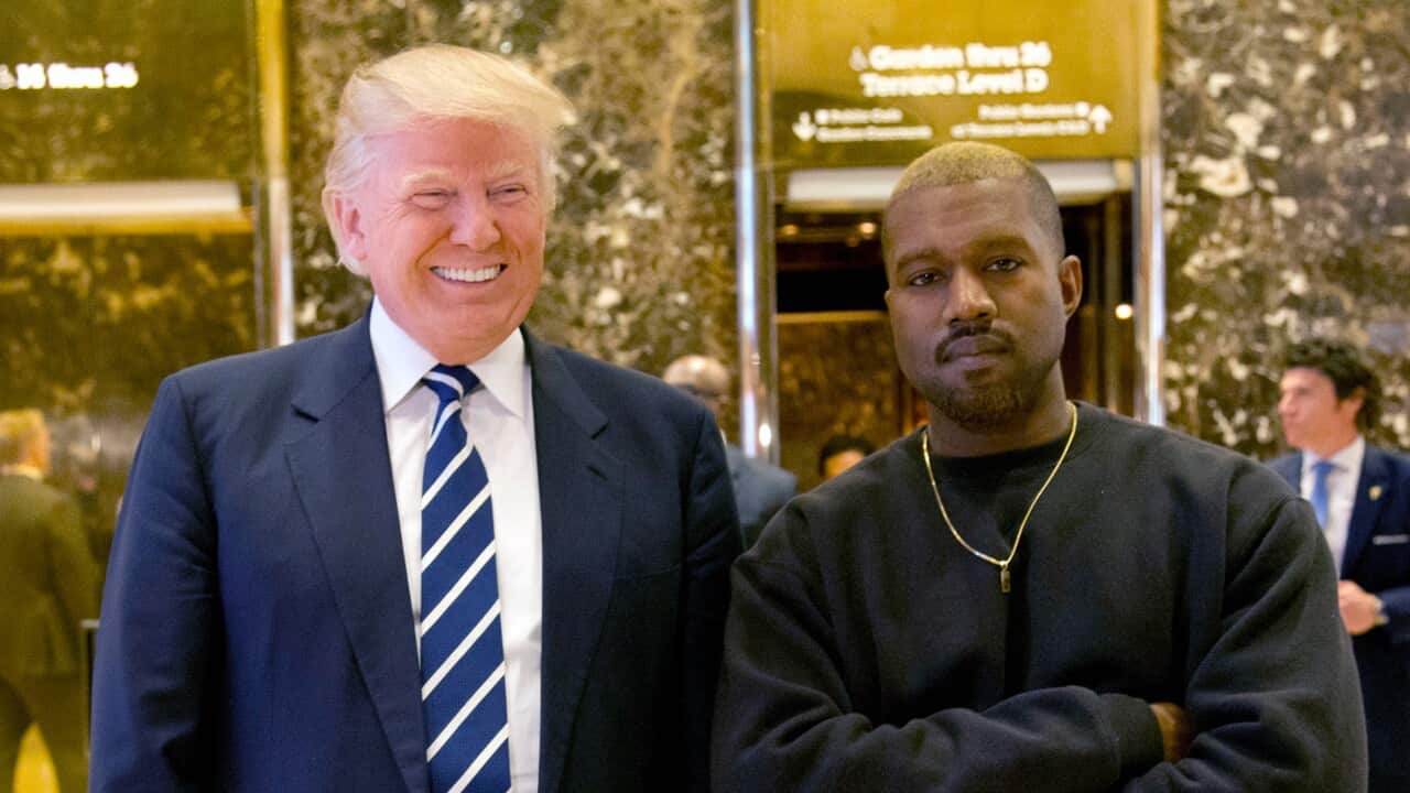 Then-President-elect Donald Trump and Kanye West pose for a picture in the lobby of Trump Tower in New York.