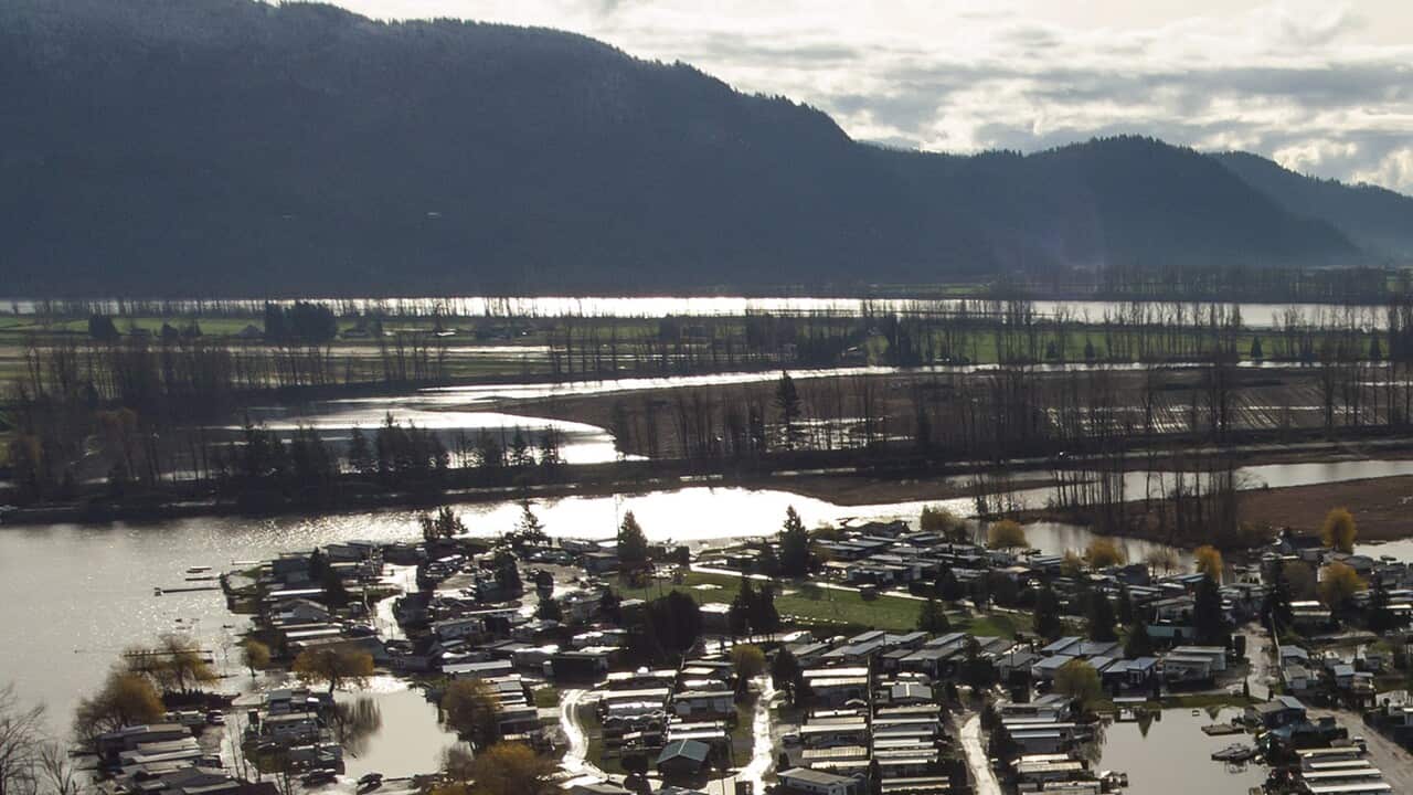 Properties on Hatzic Lake are surrounded by high water after floodwaters began to recede, near Mission, British Columbia, Sunday, Dec. 5, 2021. (Darryl Dyck/The Canadian Press via AP)