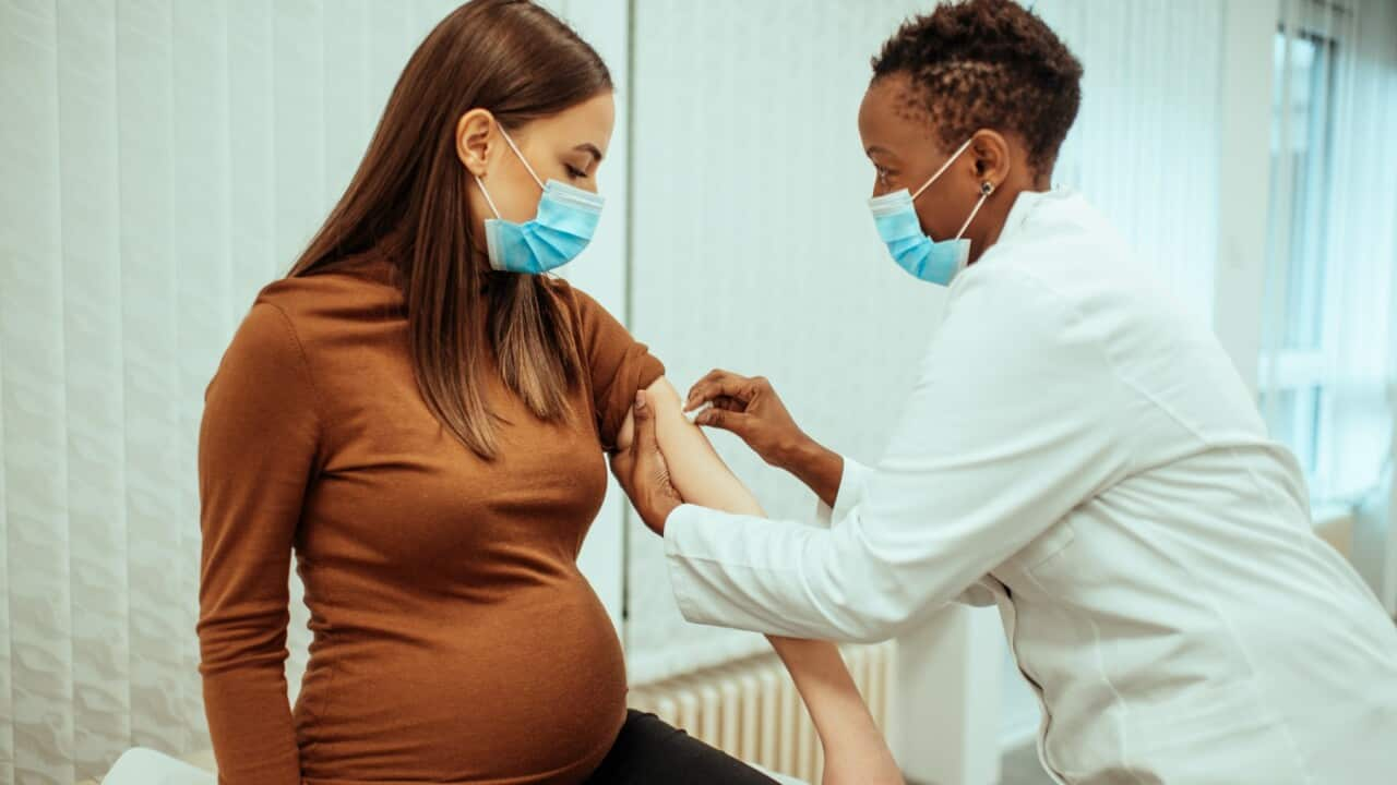 A pregnant woman receiving coronavirus jab