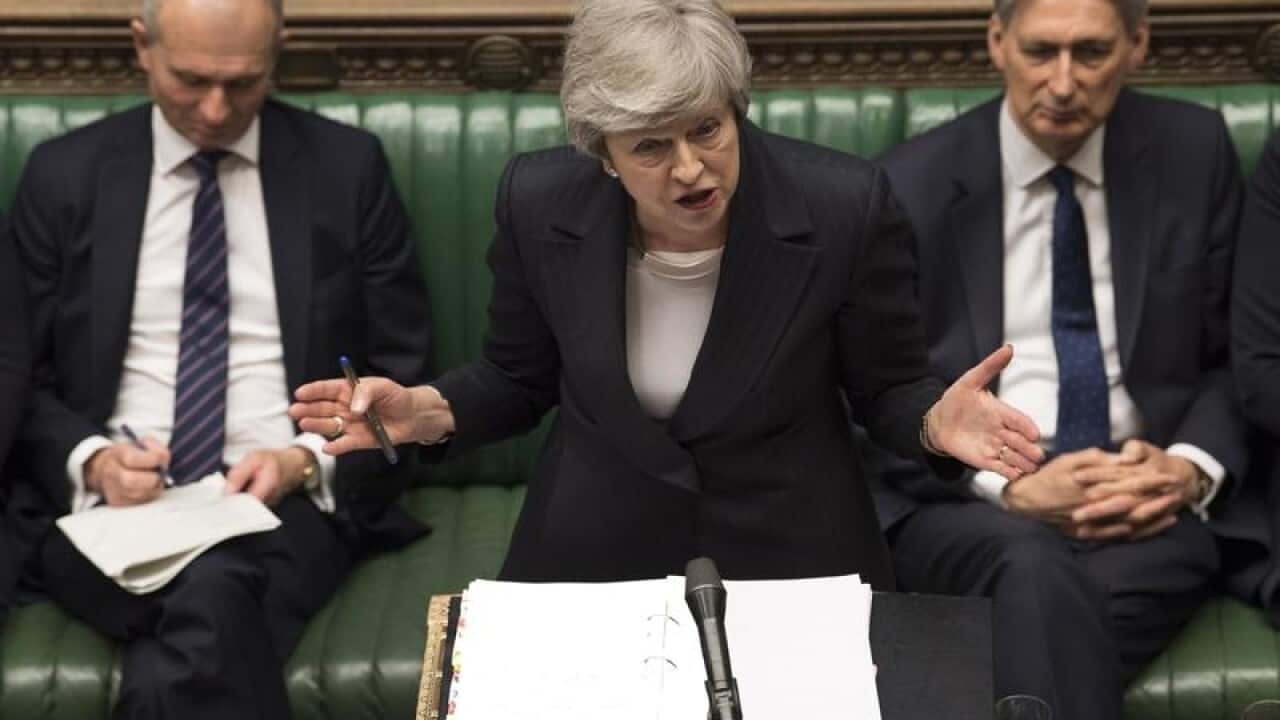 British Prime Minister Theresa May (C)