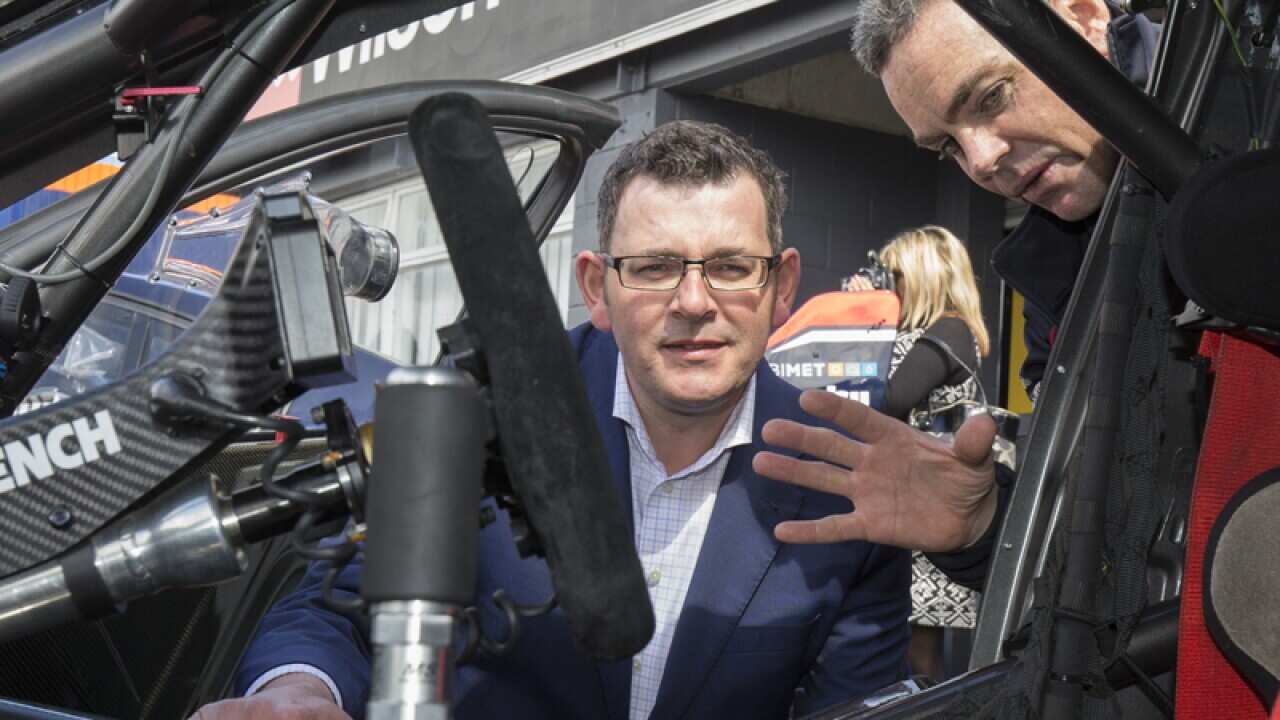 Premier Daniel Andrews speaking with V8 Supercars star Craig Lowndes