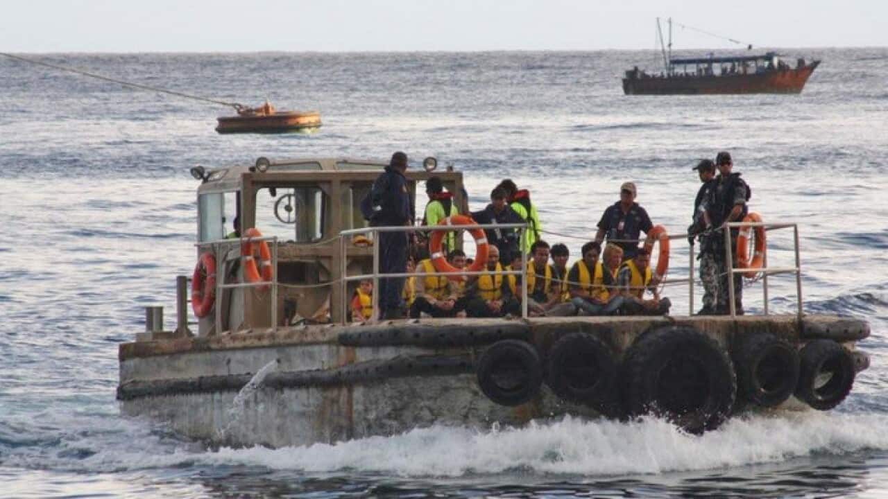 A boat carrying asylum seekers arriving at Christmas Island in 2012
