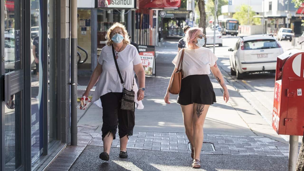 People are seen wearing masks, in Darwin, Monday, August 16, 2021.