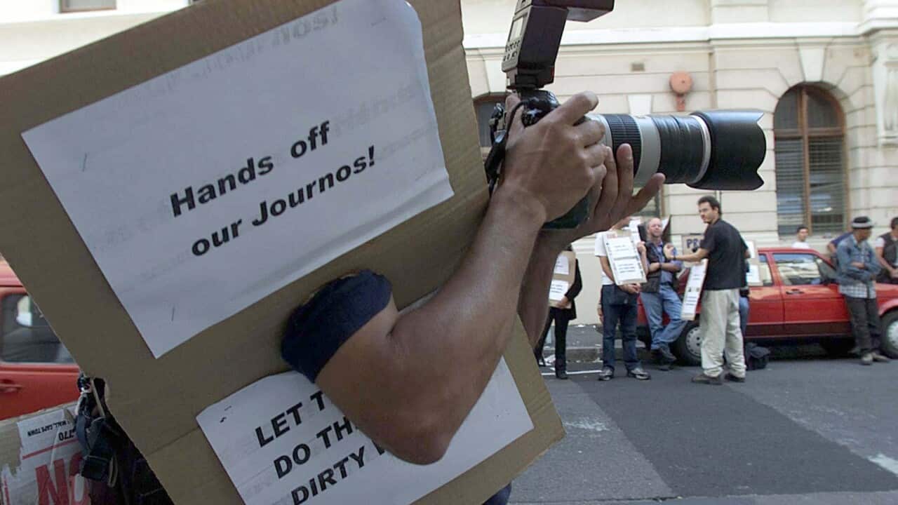 Journalists and photographers protest outside the High Court in Cape Town, South Africa Monday May 14, 2001 (AP Photo/Obed Zilwa)