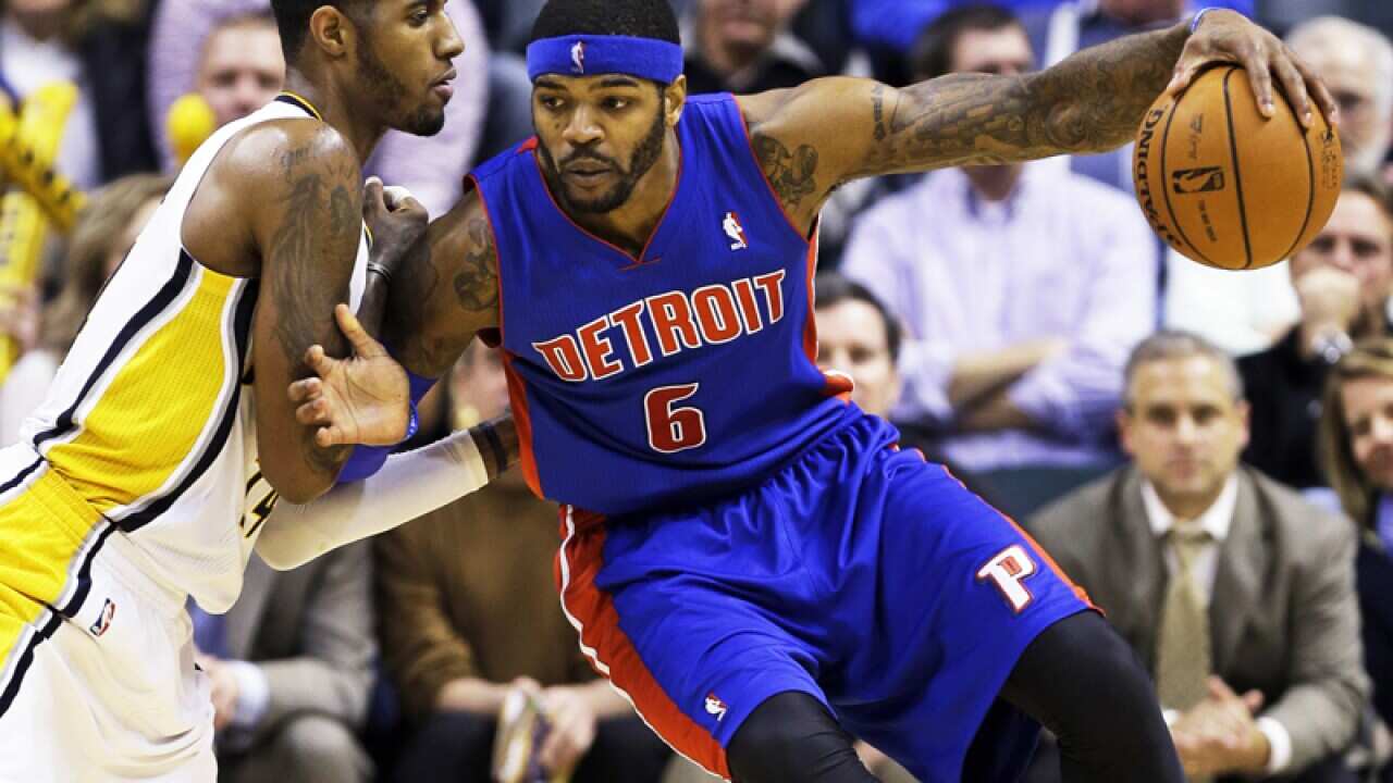 Indiana forward Paul George defends Detroit forward Josh Smith.