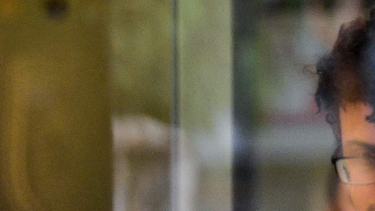 Arsalan Khawaja (centre) is seen at Parramatta Police Station in Sydney, Tuesday, December 4, 2018.