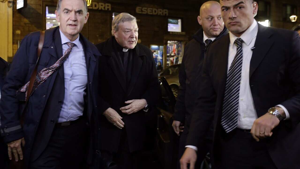 Australian Cardinal George Pell, second from left, arrives at the Quirinale hotel in Rome, Wednesday, March 2, 2016