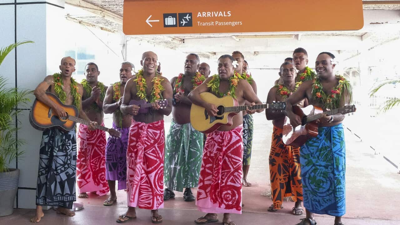 Guests receive a traditional Fijian welcome as they arrive at Nadi International airport in Fiji