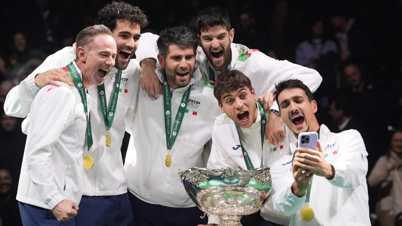 Italy's tennis team celebrates after winning the Davis Cup Finals 2025 against Spain on November 23, 2025