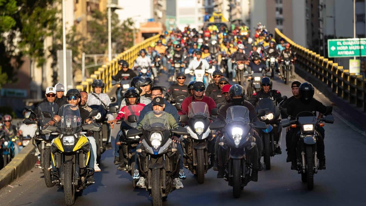 Costumed Chavistas riding motorcycles protest seizure of ships by US military