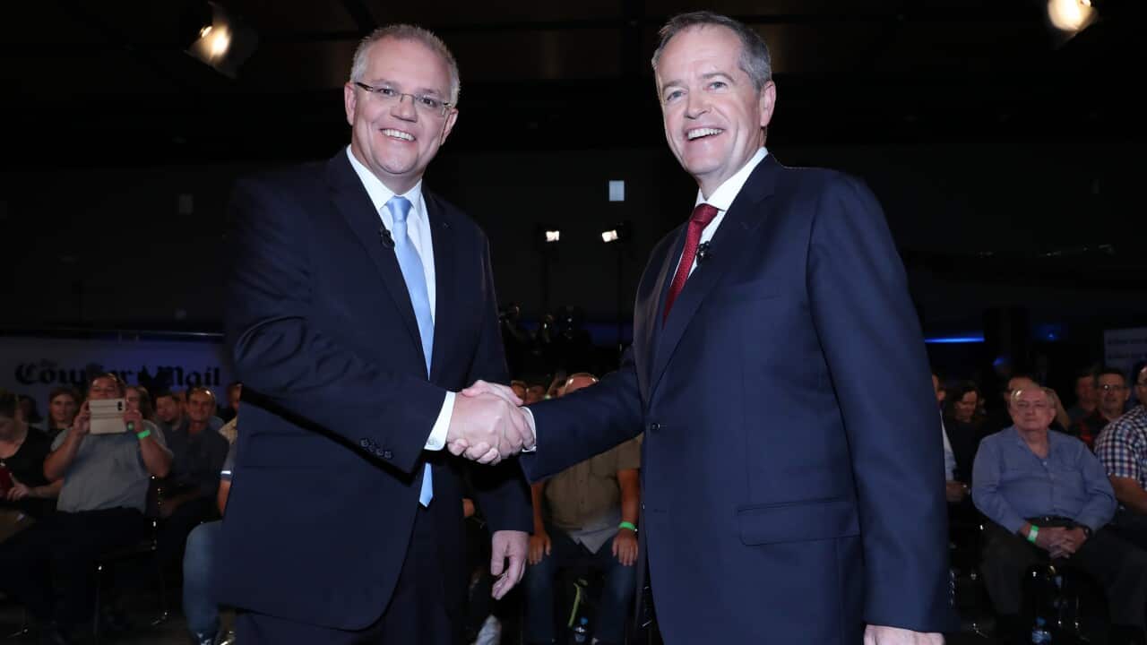 Prime Minister Scott Morrison (left) and Leader of the Opposition Bill Shorten shake hands before the People's Forum debate in Brisbane.