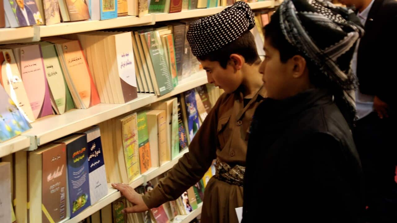 ERBIL, IRAQ - APRIL 2: Visitors look at the books during Erbil International Book Fair 2015, including boots of 200 publishers from different countries, at Sami Abdul-Rahman Park in Erbil, Iraq on April 2, 2015