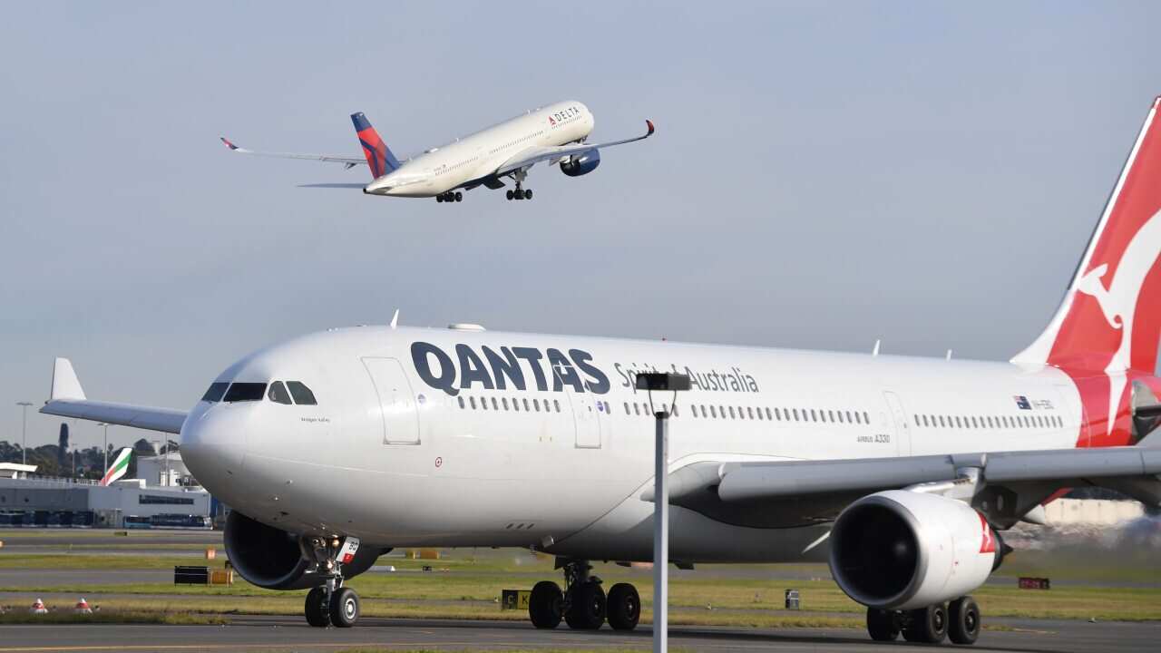 Passenger planes are seen at Sydney Airport on Tuesday, 6 July, 2021.