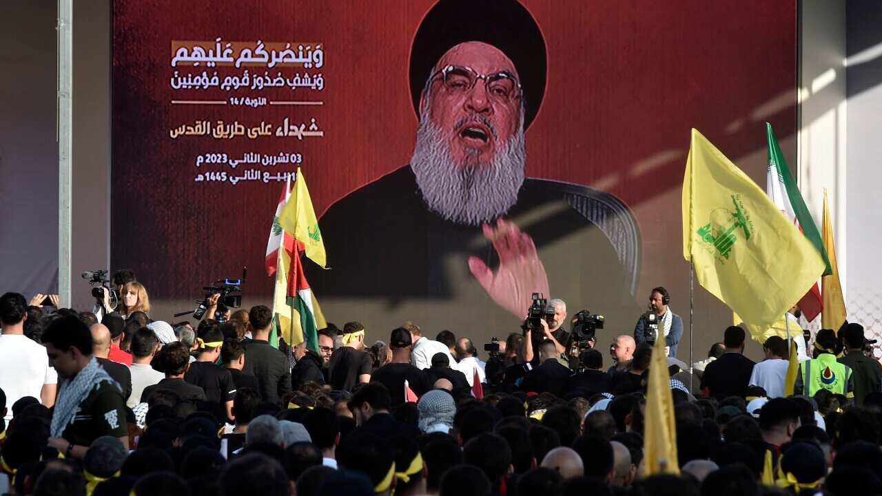 Hezbollah supporters follow the speech of Hezbollah leader Hassan Nasrallah on a screen in a southern suburb of Beirut, Lebanon