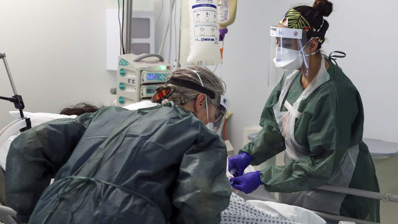 Nurses treat coronavirus patients at Frimley Park Hospital in Surrey. 