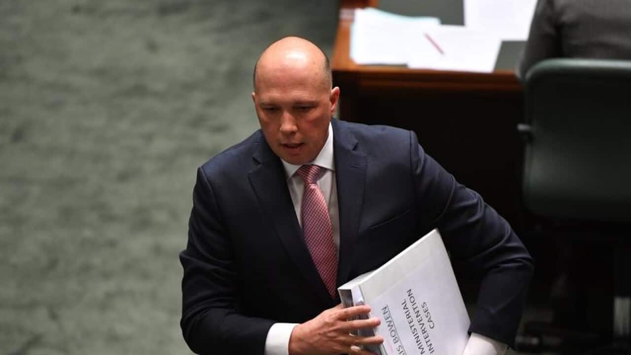 Minister for Home Affairs Peter Dutton leaves after Question Time.