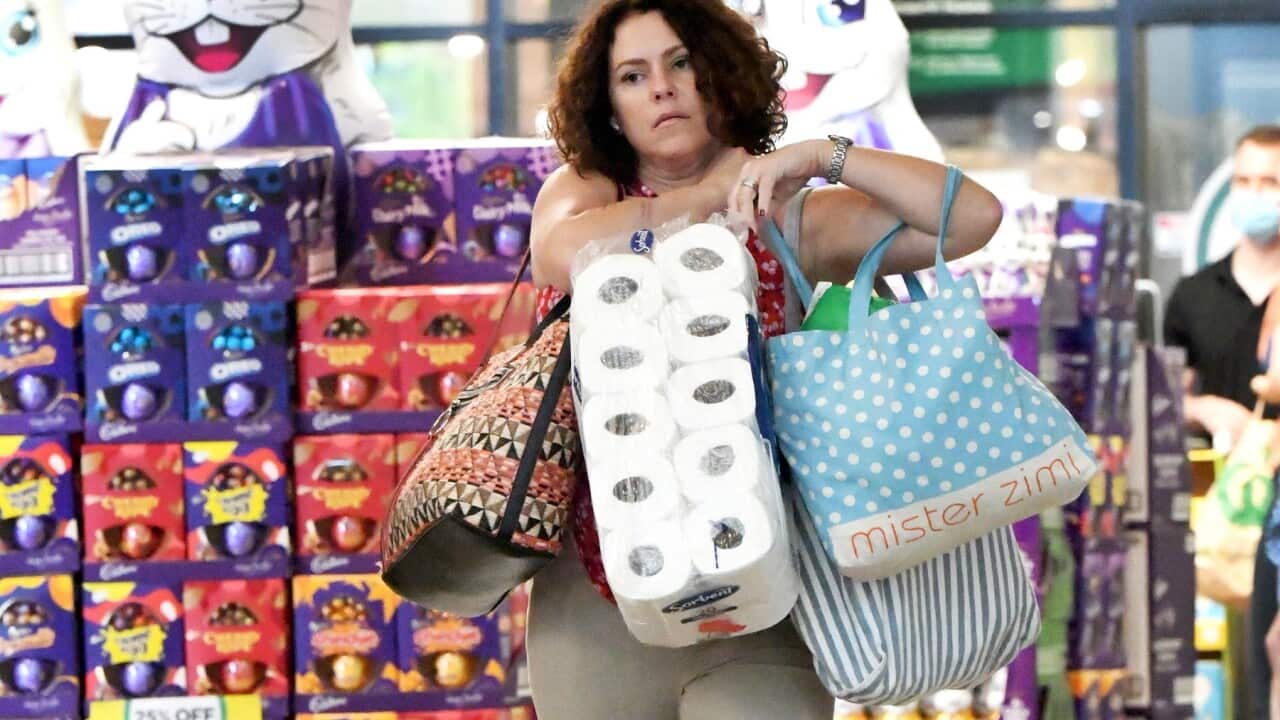 Brisbane residents are seen exiting a grocery store ahead of a 3-day lockdown