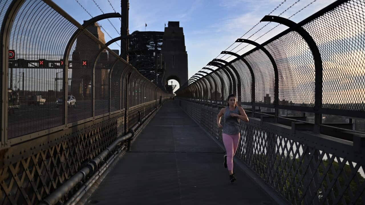 Woman jogiing over the Sydney Harbour Bridge