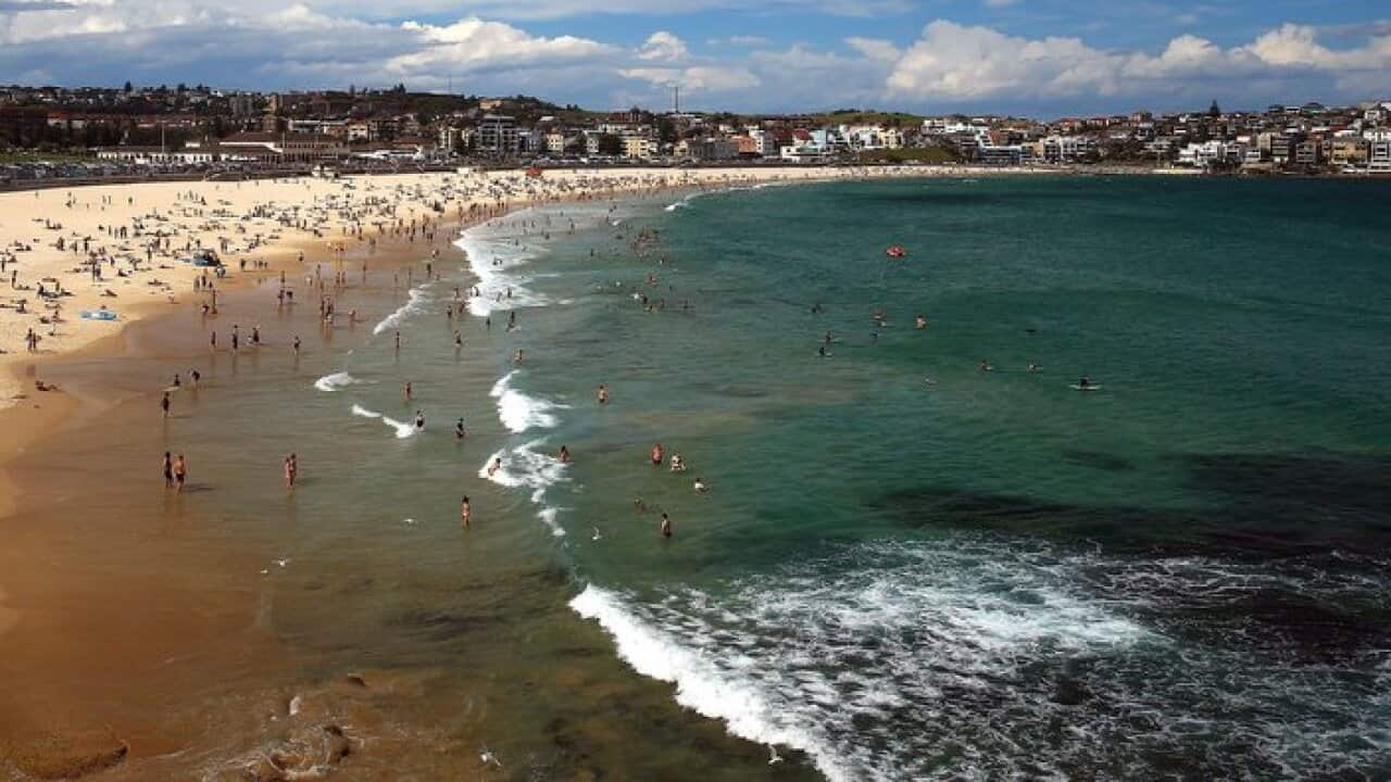Beachgoers gather at Bondi Beach, Sydney, Saturday, January 13, 2018. (AAP Image/Jeremy Ng) NO ARCHIVING