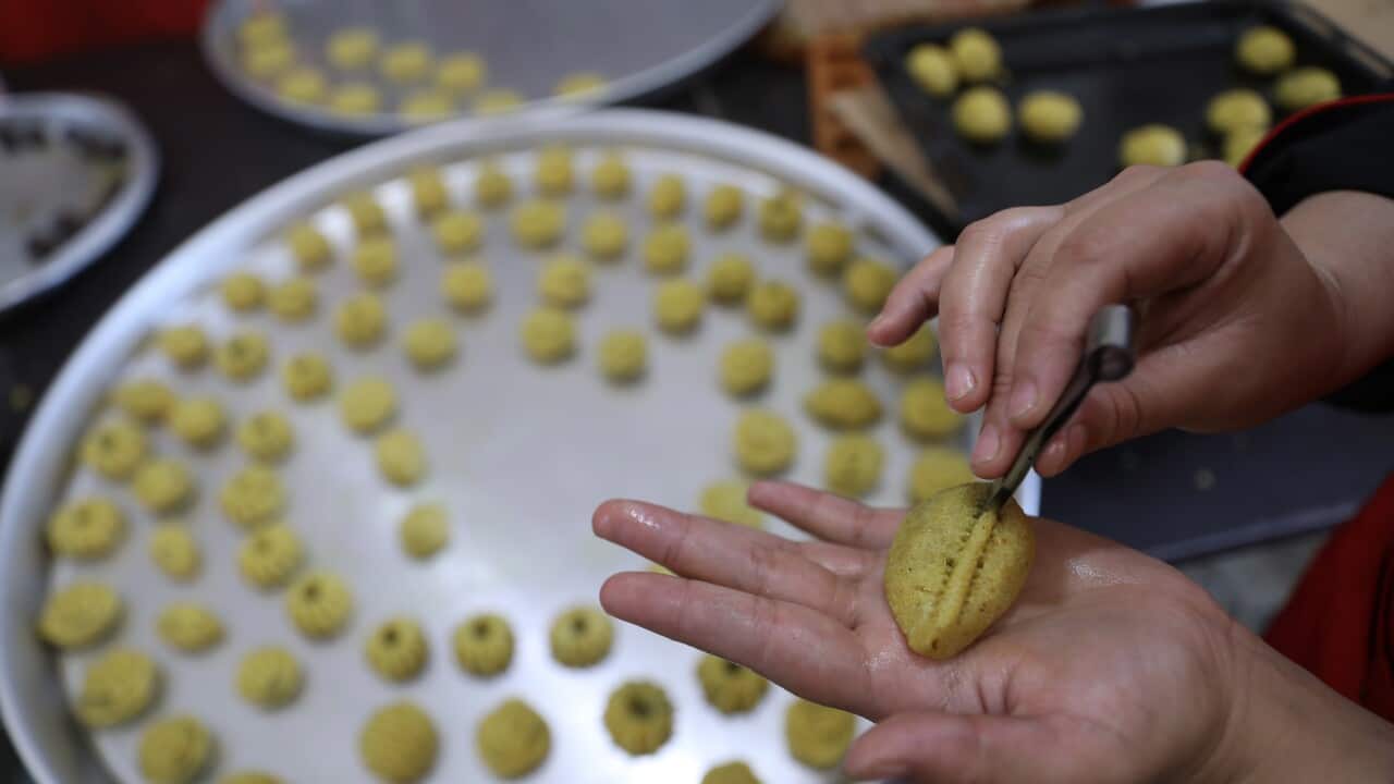 Women prepare kahk for Eid