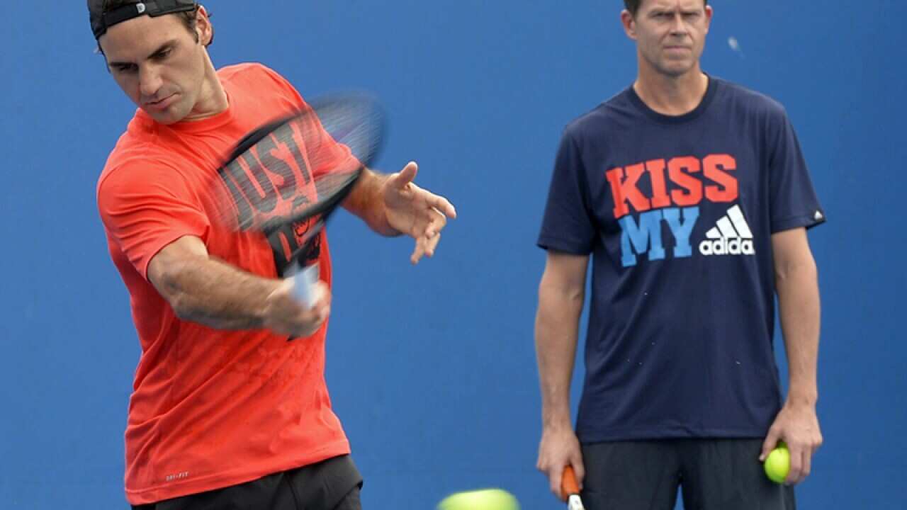 Stefan Edberg (R) oversees Roger Federer training at Melbourne Park