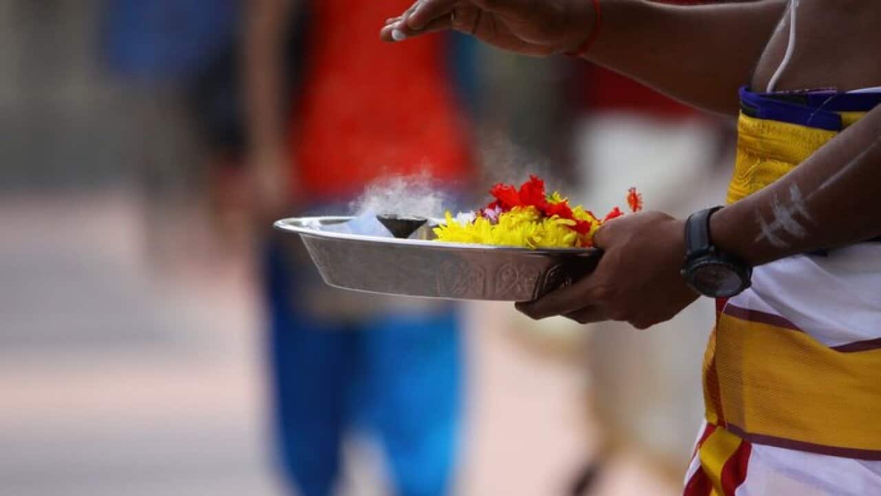 MALAYSIA, Kajang: A Hindu priests prepares for prayers at a Hindu temple in Kajang, Malaysia on October 18, 2017 to celebrate Deepavali, also known as the 'Festival of Lights'. (AAP Image/NEWZULU/farid tajuddin).