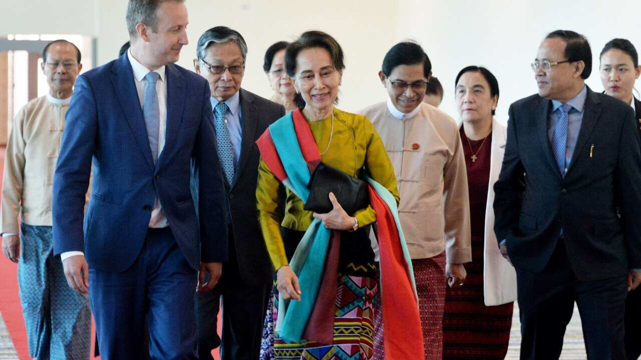 Myanmar's State Counsellor Aung San Suu Kyi and Wouter Jurgens, Netherlands ambassador to Myanmar, speaking as Suu Kyi prepares to leave Myanmar.