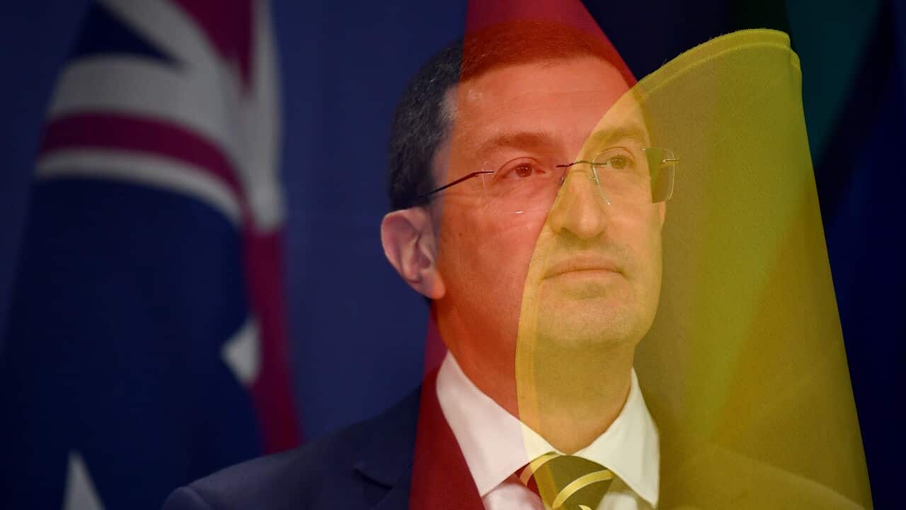 An in-camera double exposure of Julian Leeser as he speaks to media during a press conference in Sydney, Tuesday, April 11, 2023.