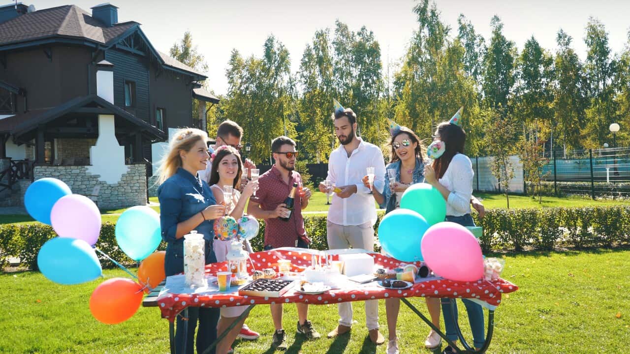 beautiful-young-people-laughing-having-fun-on-the-street-drinking-prosecco-celebrating-SBI-350616676.jpg