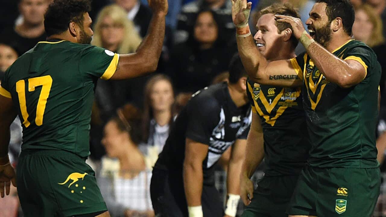 Australian players celebrate after scoring a try