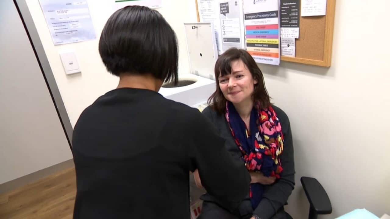 Oksana receives a flue shot