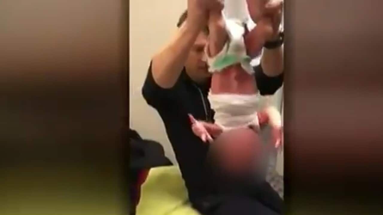 A Melbourne chiropractor has posted a video online of him performing controversial spinal treatments on a two-week-old baby.