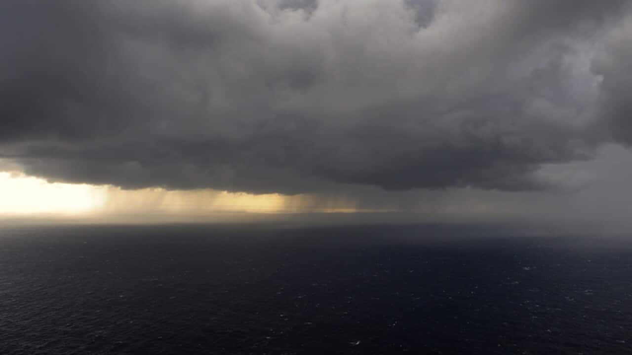A storm front and isolated showers
