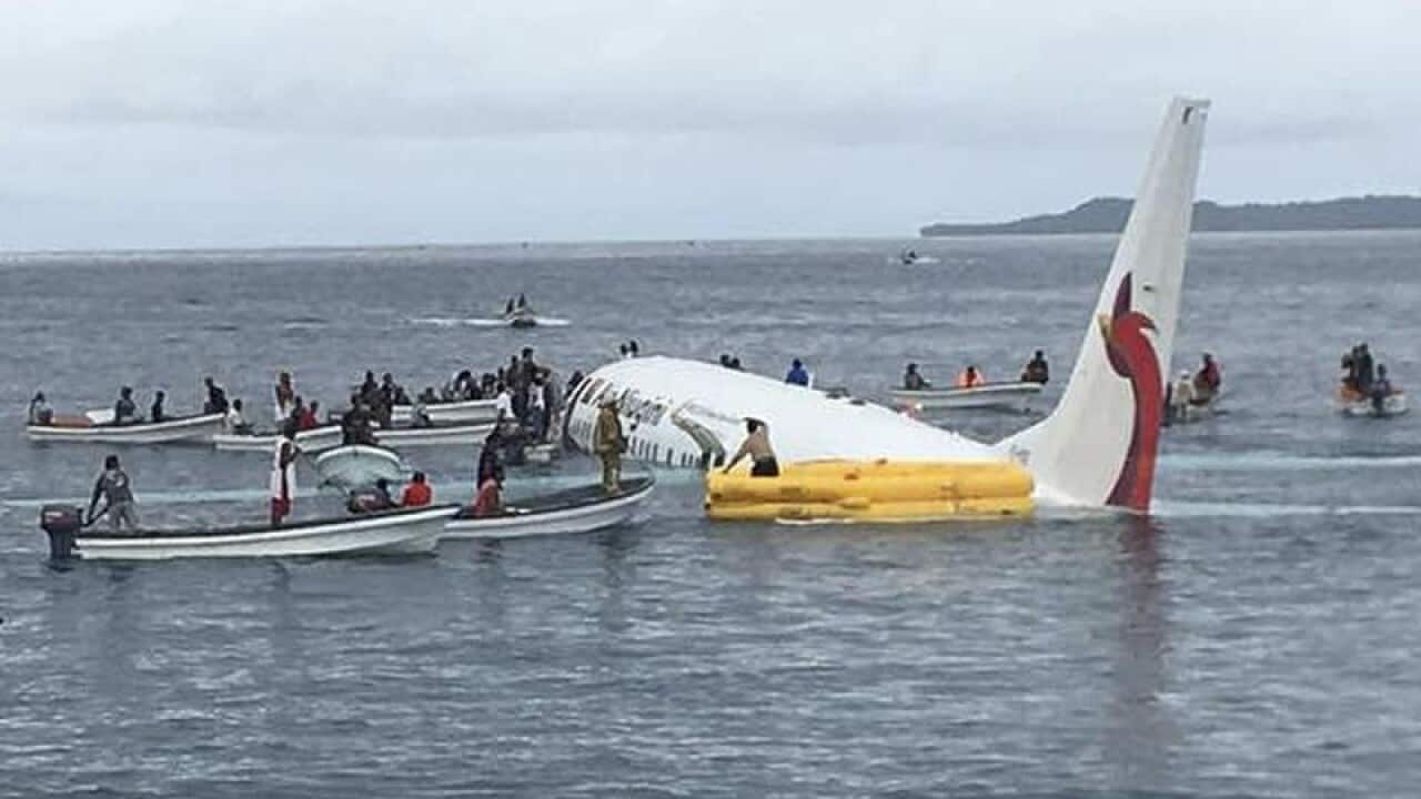 Passengers are rescued from an Air Niugini crash.