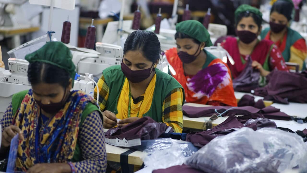 Employees work in a sewing section of the Snowtex Sportswear Ltd in Savar, Bangladesh.