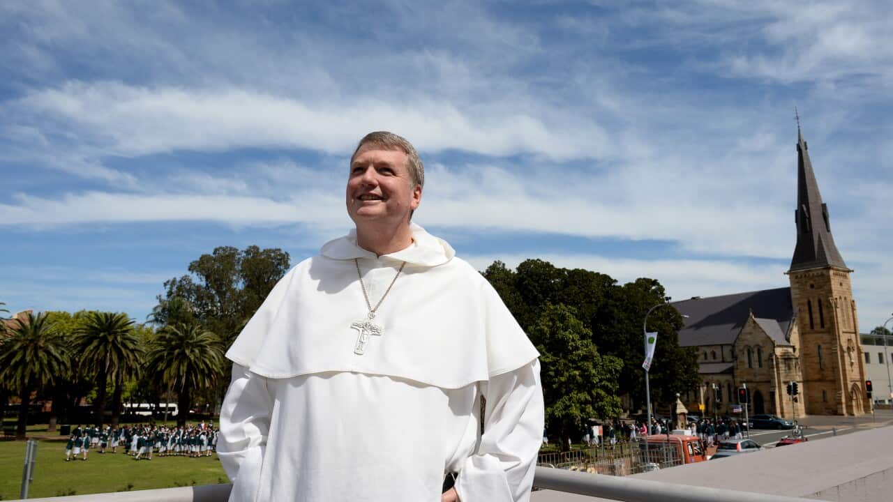 Archbishop-elect Anthony Fisher poses for photographs in Sydney